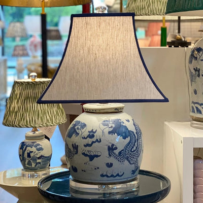 oatmeal square lampshade on a blue and white lamp