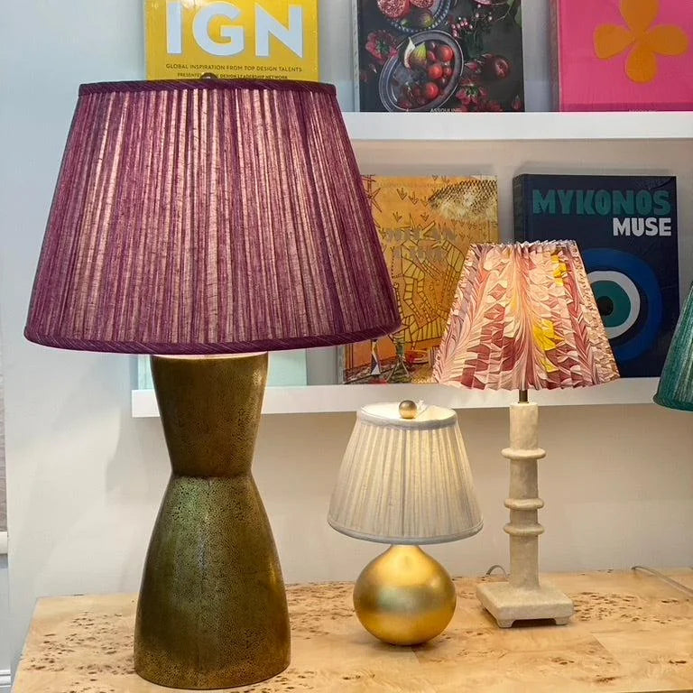 Large brass lamp and fuchsia lamp shade