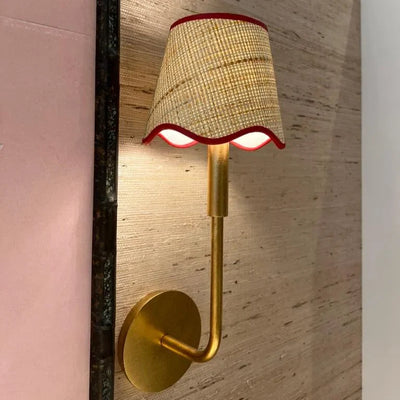 scalloped raffia sconce shade with red trim