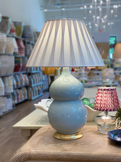 Silk smocked lampshade on a blue Hwang Bishop lamp