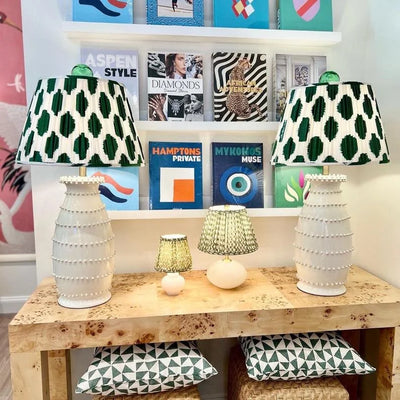 Green and white dot lampshades on ivory lamps