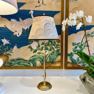 marbled lampshade on a brass lamp