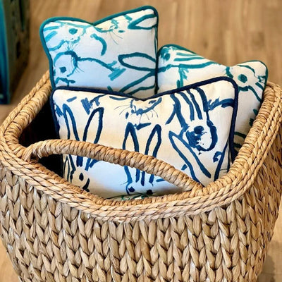 Sweater weave basket with Hunt Slonem pillows