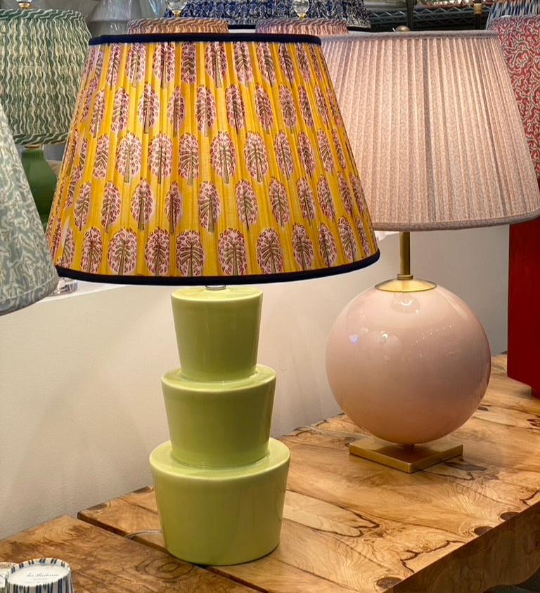 Yellow block print lampshade on a green lamp