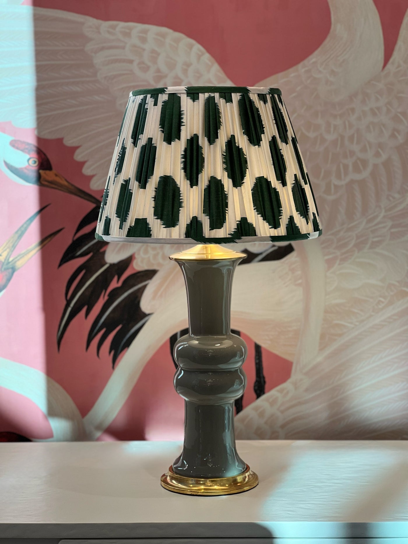 White and green dot ikat lampshade and Christopher Spitzmiller lamp