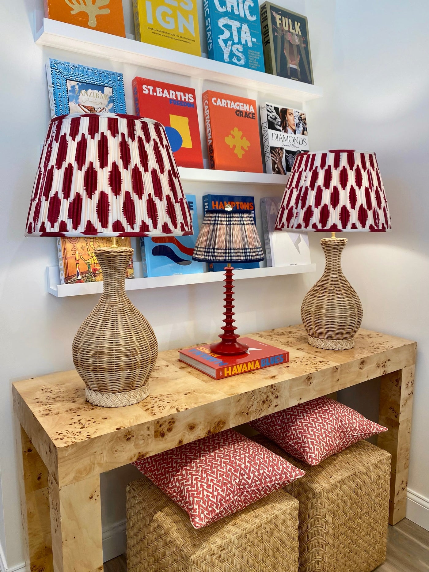 Red and white ikat lampshades on rattan lamps