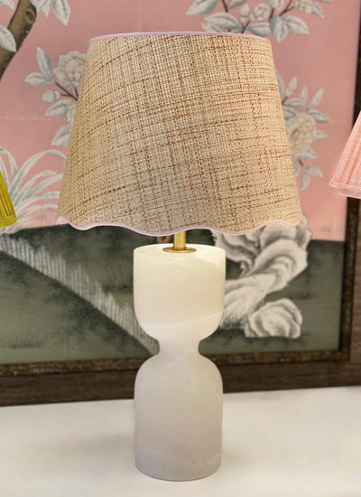 Scalloped Raffia Lampshade with Light Pink Trim on an alabaster lamp