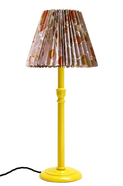 Pleated marbled paper lampshade on yellow lamp