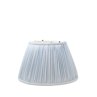 Light blue lampshade with polka dot interior